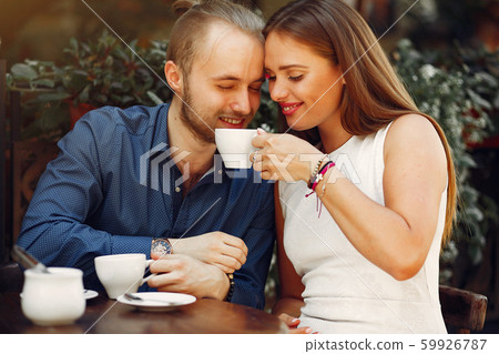 Beautiful couple spend time in a summer city Beautiful couple spend time in a summer city 59926787