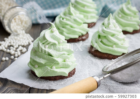 Homemade apple zefir fir-tree, placed on chocolate Homemade apple zefir fir-tree, placed on chocolate 59927303