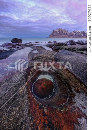 The Dragons Eye is a unique natural rock formation at Uttakleiv Beach, Lofoten Islands, Norway The Dragons Eye is a unique natural rock formation at Uttakleiv Beach, Lofoten Islands, Norway 59927683