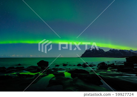 Northern lights, Aurora Borealis, with nice reflection at the Uttakleiv Beach, Lofoten, Norway Northern lights, Aurora Borealis, with nice reflection at the Uttakleiv Beach, Lofoten, Norway 59927724