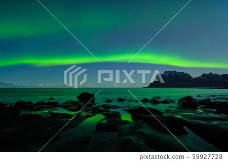Northern lights, Aurora Borealis, with nice reflection at the Uttakleiv Beach, Lofoten, Norway Northern lights, Aurora Borealis, with nice reflection at the Uttakleiv Beach, Lofoten, Norway 59927728