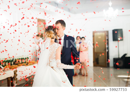 Beautiful wedding couple just married and dancing their first dance Beautiful wedding couple just married and dancing their first dance 59927733