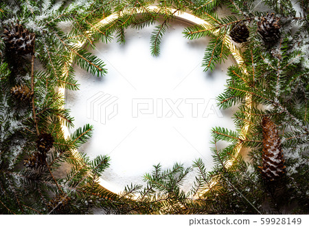 Christmas round frame made by neon and winter things on white background. Christmas round frame made by neon and winter things on white background. 59928149