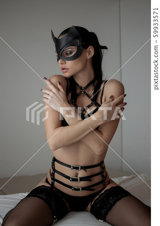 Brunette girl in a cat mask Brunette girl in a cat mask 59933571