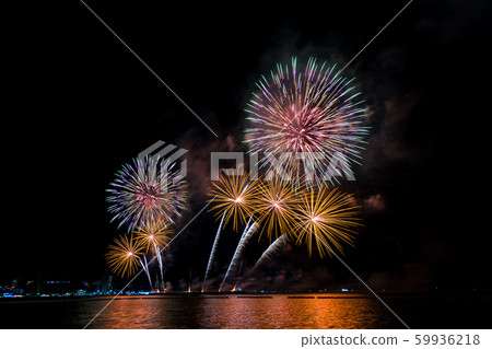 Colorful fireworks of various colors at night  59936218