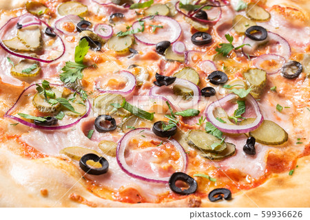 Cheap pizza with ham, onion, pickled cucumbers and 59936626