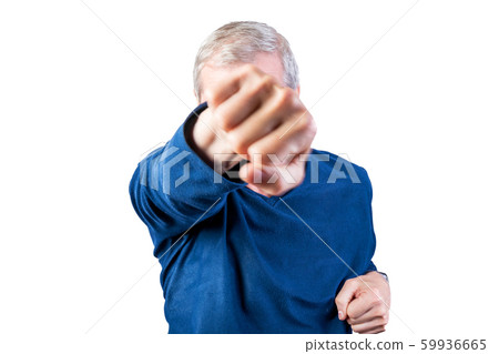 An elderly man demonstrates fist fight. Isolated 59936665