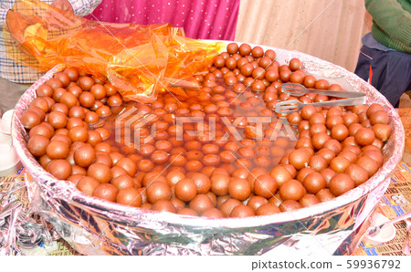 Gulab Jamun is a milk-solid-based Indian sweet Gulab Jamun is a milk-solid-based Indian sweet 59936792