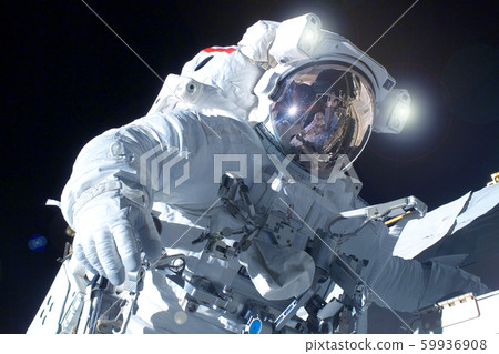 Astronaut in a spacesuit in open space. Elements 59936908