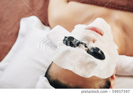 Beauty salon client ready for UV therapy Beauty salon client ready for UV therapy 59937397