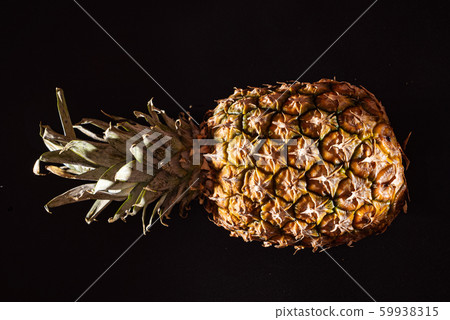 pineapple on the black background pineapple on the black background 59938315