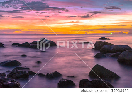 Rocks in the sea at sunset 59938953