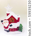 Santa Claus's ceramic house is covered with snow, 59939230