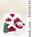 Santa Claus's ceramic house is covered with snow, 59939234