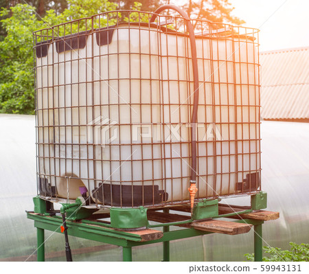 Cube capacity for drip irrigation of plants in the garden, modern drip irrigation system, industrial Cube capacity for drip irrigation of plants in the garden, modern drip irrigation system, industrial 59943131