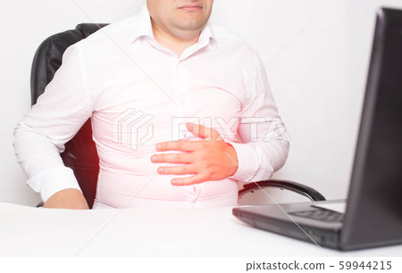 Male office worker holding stomach stomach, gastritis and stomach ulcer, Helicobacter pylori. 59944215