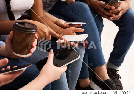 Modern people problems. Teens using phones, closeup 59945545