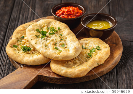 Homemade naan bread with garlic and butter. 59946639