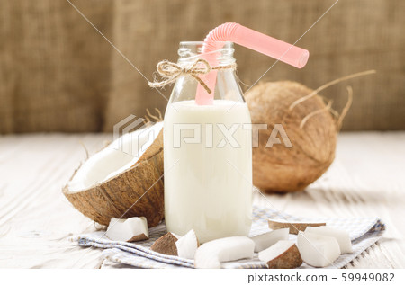 Glass bottle of milk or yogurt on blue napkin on Glass bottle of milk or yogurt on blue napkin on 59949082