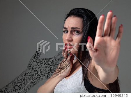 Woman in fear of domestic abuse and violence, concept of female rights Woman in fear of domestic abuse and violence, concept of female rights 59949245