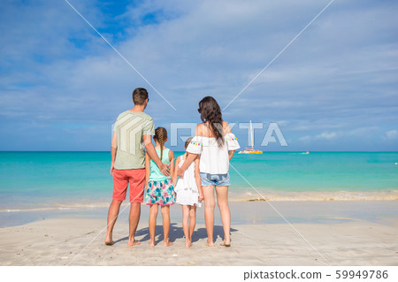 Happy family on the beach during summer vacation Happy family on the beach during summer vacation 59949786