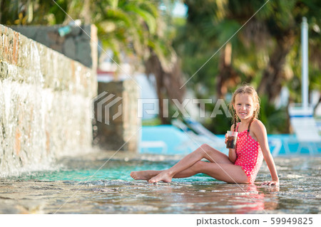 Adorable little girl in swimming pool outdoors Adorable little girl in swimming pool outdoors 59949825