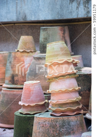 A group of terracotta pots that are stacked in the A group of terracotta pots that are stacked in the 59951179