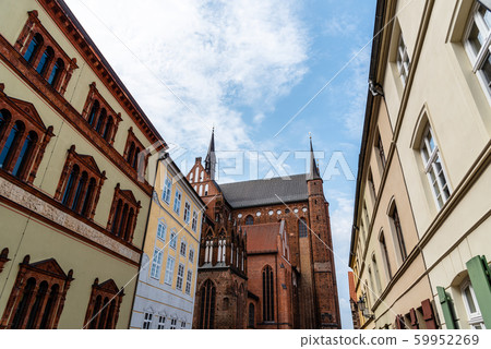 Old houses and St. George church in historic centre of Wismar, Germany 59952269