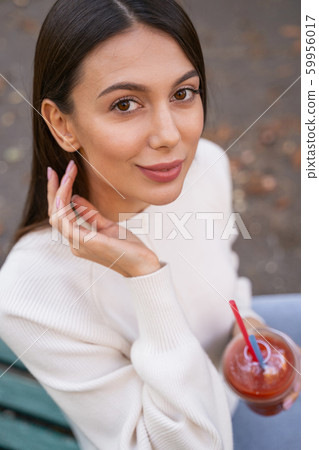 Portrait of amazing young female that posing on camera Portrait of amazing young female that posing on camera 59956017