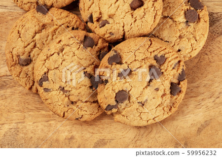 Gluten-free chocolate chip cookies close-up on a rustic wooden background, top-down shot 59956232