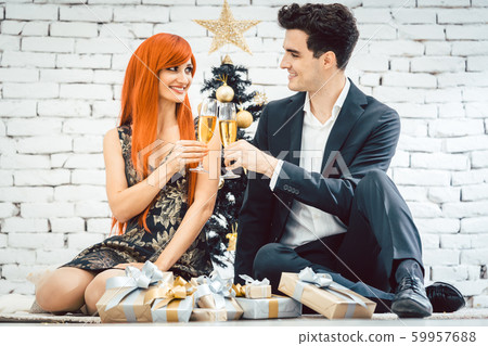 Couple drinking sparkling wine on Christmas Couple drinking sparkling wine on Christmas 59957688