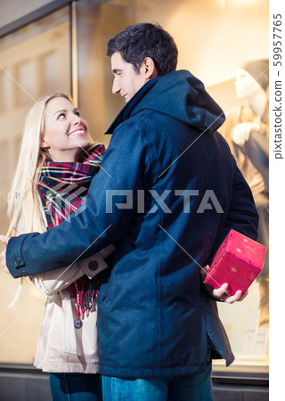 Couple looking at shopping window 59957765