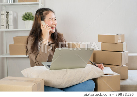Happy Asian young entrepreneur, talking on the Happy Asian young entrepreneur, talking on the 59958156