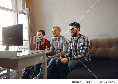 Group of fans are watching a soccer moment on the TV Group of fans are watching a soccer moment on the TV 59959629