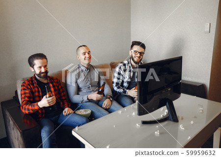 Group of fans are watching a soccer moment on the TV Group of fans are watching a soccer moment on the TV 59959632