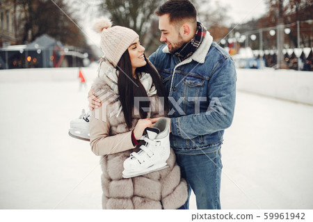 Cute couple in a ice arena Cute couple in a ice arena 59961942
