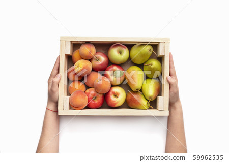 Garden fruits in eco wooden box in wman hands 59962535