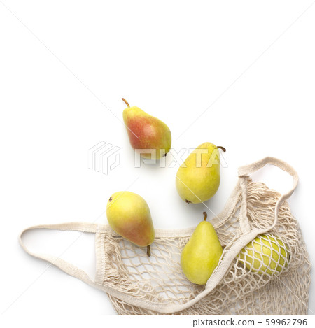Raw fresh juicy pears inside string reusable shopping bag Raw fresh juicy pears inside string reusable shopping bag 59962796