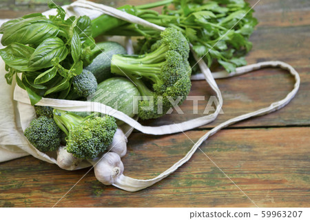 Eco shopping of fresh and natural vegetables on wooden table Eco shopping of fresh and natural vegetables on wooden table 59963207