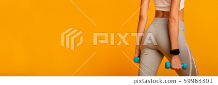 Unrecognizable Woman Holding Dumbbells Exercising Back To Camera In Studio 59963301