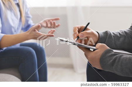 Millennial woman discussing problems with personal therapist 59963327