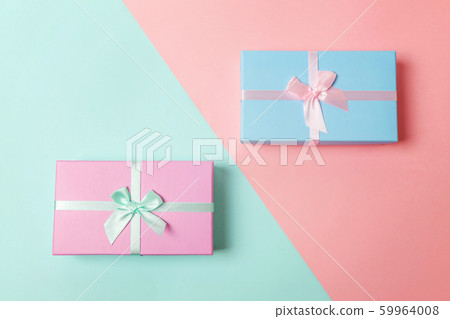 Gift box isolated on blue and pink background 59964008