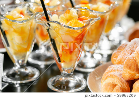 Breakfast buffet. Fresh fruit cocktail in glasses. Dessert with pieces of fruit. Morning hotel Breakfast buffet. Fresh fruit cocktail in glasses. Dessert with pieces of fruit. Morning hotel 59965209