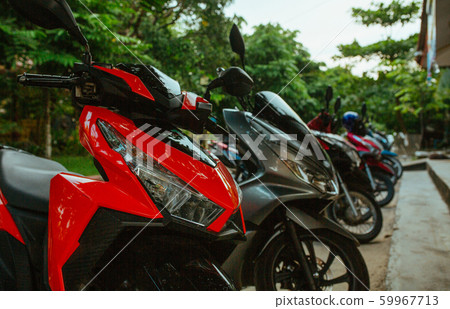 Motorbikes, scooters, traditional two wheels transport in Asia Motorbikes, scooters, traditional two wheels transport in Asia 59967713