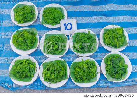 Spirogyra, Chlorophyta, fragmentation, algae, spirogyra food for fish, sold at local market in Thailand. 59968480