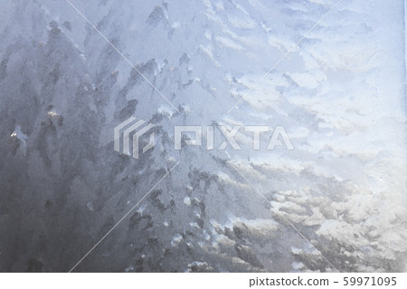 Texture of frost patterns on the window. Abstract winter background Texture of frost patterns on the window. Abstract winter background 59971095