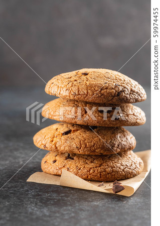 Chocolate cookies on grey table. Chocolate chip cookies shot. Homemade food on grey background. 59974455
