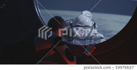 Astronaut talking with spacewalking crewmate Astronaut talking with spacewalking crewmate 59976687