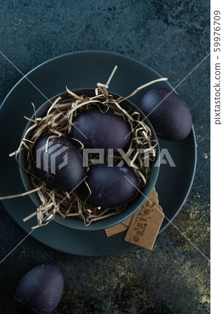 Easter eggs on a dark background. Colored Easter eggs. Easter eggs on a dark background. Colored Easter eggs. 59976709