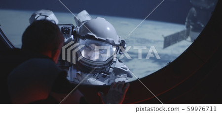 Astronaut talking with spacewalking crewmate Astronaut talking with spacewalking crewmate 59976711